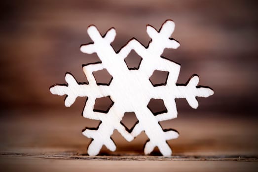A Single Snowflake on Wood, Winter Background