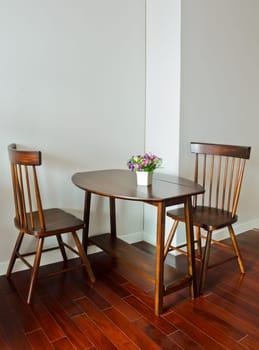 Small dining table with artificial flower pot
