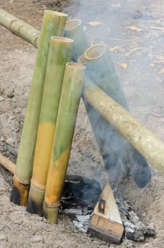 Streamed rice cooking in bamboo stalk