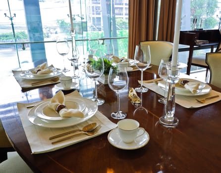 Dining room interior, tableware on dining table