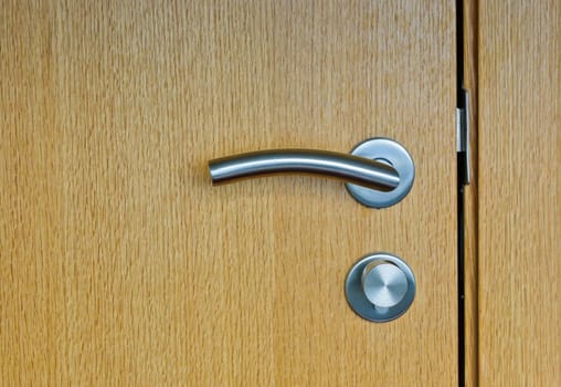 Modren style door handle on wooden door