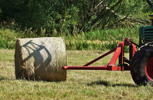 Tractor with straw bales