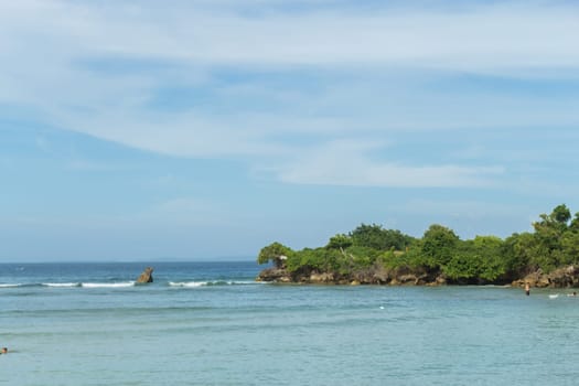Beautiful secluded sandy beach in the Caribbean with white sand and blue sky as in paradise