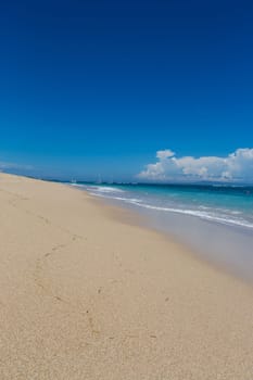 Beautiful secluded sandy beach in the Caribbean with white sand and blue sky as in paradise