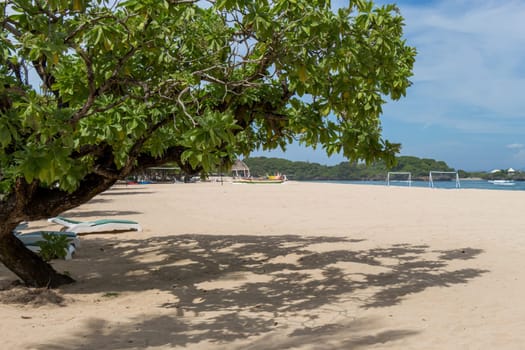 Beautiful secluded sandy beach in the Caribbean with white sand and blue sky as in paradise