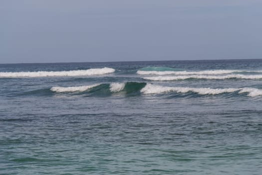 Beautiful secluded sandy beach in the Caribbean with white sand and blue sky as in paradise