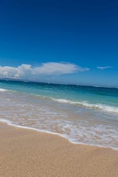 Beautiful secluded sandy beach in the Caribbean with white sand and blue sky as in paradise