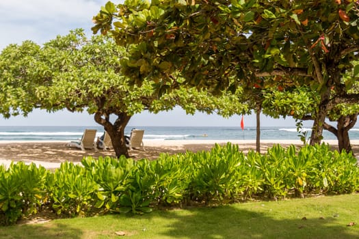 Quiet resort village town in Bali with lush vegetation in summer with blue sky