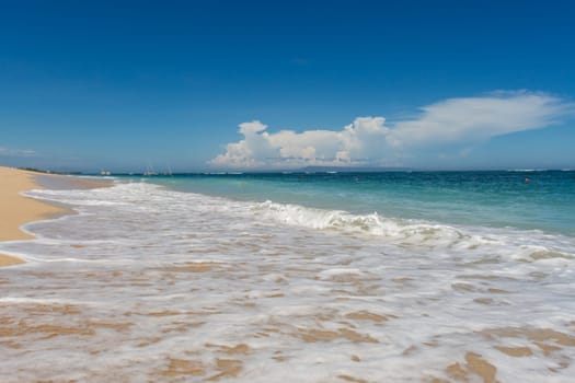 Beautiful secluded sandy beach in the Caribbean with white sand and blue sky as in paradise