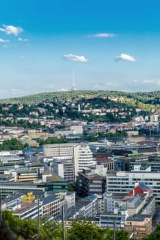 Picturesque view of Stuttgart Germany the modern skyscrapers under the traditional historical architecture overlooking the surrounding hills on a sunny day