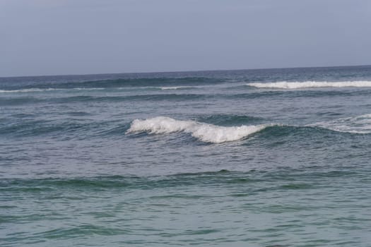 Beautiful secluded sandy beach in the Caribbean with white sand and blue sky as in paradise