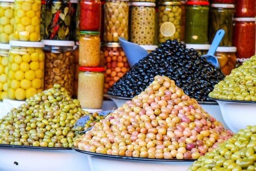 colourful display with olives and antipast at a market stall in Morocco