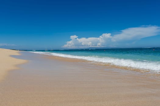 Beautiful secluded sandy beach in the Caribbean with white sand and blue sky as in paradise