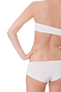 attractive sexy woman's body in white underwear with briefs and bra insulated against white background