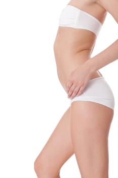 attractive sexy woman's body in white underwear with briefs and bra insulated against white background