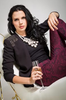 elegant attractive young woman with champagne and air snakes party outfit fashion celebration