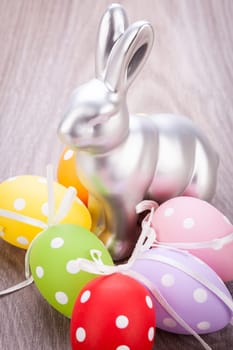 Colourful yellow and red Tulip with Easter eggs decorated at Easter with text space on green background