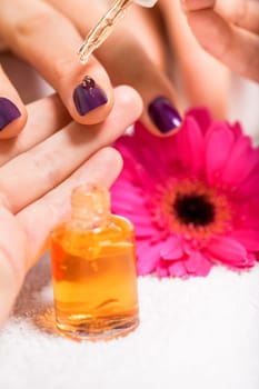 Professional nail designer at a manicure with female hands in a nail salon