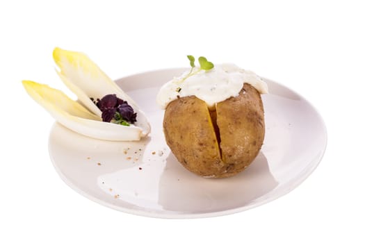 fresh foilpotato from the oven with herb quark sour cream and fresh herbs