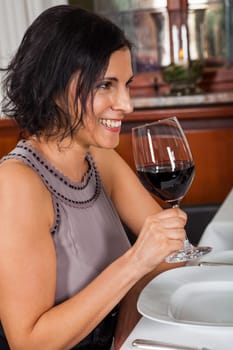 Young couple group in a restaurant cheerful while drinking