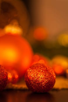 Warm golden and orange Christmas decoration with candlelight as close-up in context