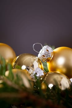 Golden shiny Christmas tree decoration Advebtsschmuck on green fir branches as close-up