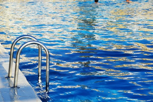 Swimming pool in touristic resort during summer time