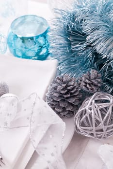 Stylish table with Christmas decoration in turquoise and silver shiny with cutlery