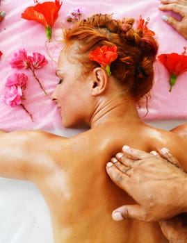 Beautiful young woman getting professional spa massage