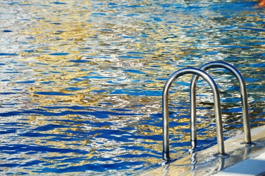 Swimming pool in touristic resort during summer time