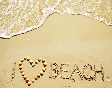 I love beach written on the sand