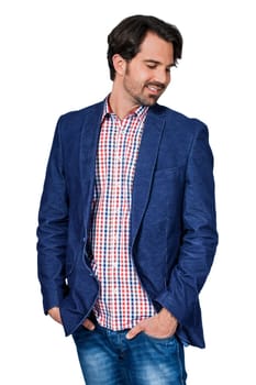 Young man in trendy casual look with dark hair and beard isolated against a white background