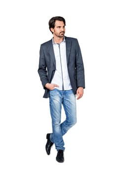 Self-proclaimed man in casual clothes with dark hair and beard isolated against a white background