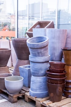 Flower pots made of stone Glazed and unglazed in retail outdoors