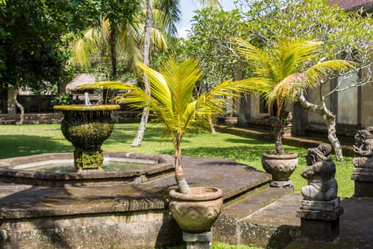 Fountain in an artificial garden in summer in Bali
