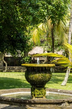 Fountain in an artificial garden in summer in Bali