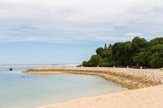Beautiful secluded sandy beach in the Caribbean with white sand and blue sky as in paradise