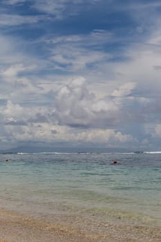 Beautiful secluded sandy beach in the Caribbean with white sand and blue sky as in paradise