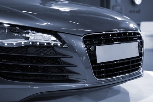 The head of sportive car in blue tone