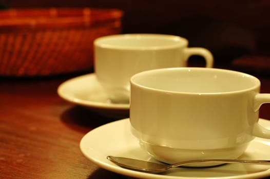 Two tea-cups and handmade basket