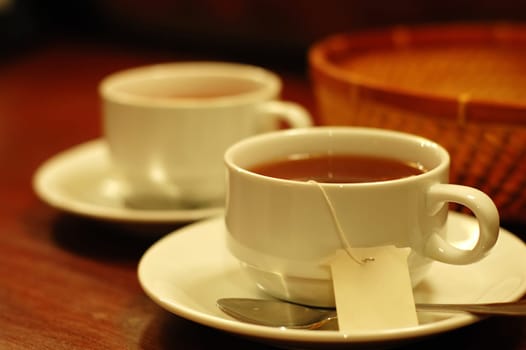 Two tea-cups and handmade basket