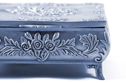 Old silver metallic jewelry casket over white background