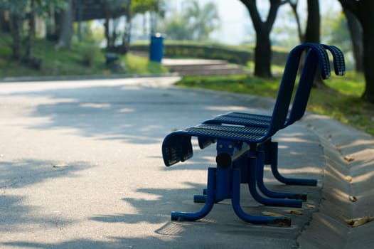 The walk way and bench in city park