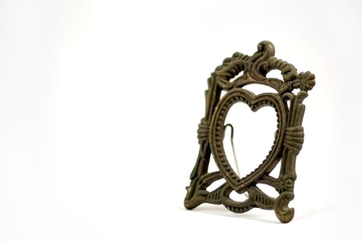 The antique photo frame isolated over white