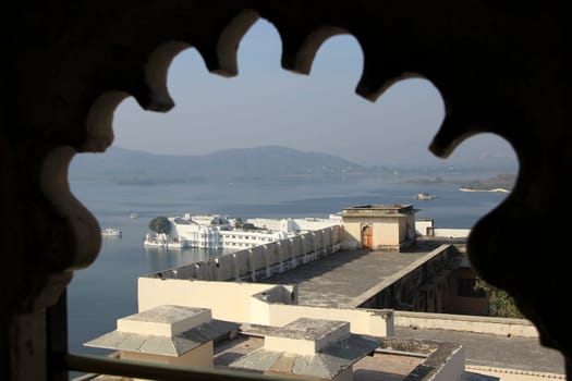 View of terrace, Pichhola lake and palace from balcony window of City Palace, Udaipur, Rajasthan, India, Asia