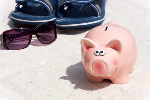 Piggy bank and beach accessories,save for holidays