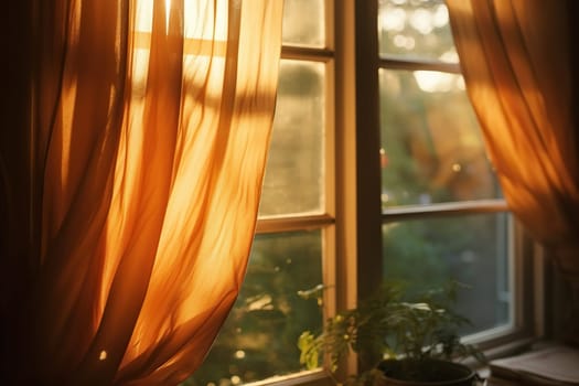 View of an old window with curtains in the rays of sunset, a plant on the windowsill. Home comfort.