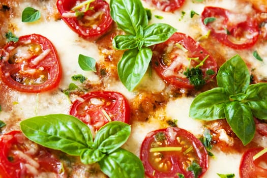 Pizza Margherita with fruity tomatoes,basil,mozzarella