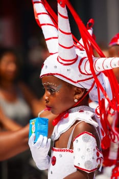 Rotterdam, the Netherlands - July 19, 2014, Young carnival dancer in the parade at the Caribbean Carnival in Rotterdam on July 19 in Rotterdam, The Netherlands.