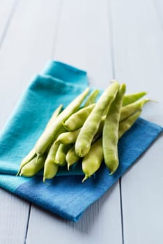 Fresh green Beans on wooden background close up